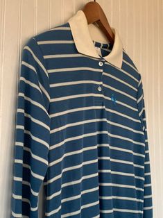 "NEW with original tags! NWT 80s Vintage Garan Blue White Striped Long Sleeve Polo Shirt. Partial button up with classic Horse Logo. Size Medium. Authentic vintage deadstock from the early 80s, New With Tags! Brand - Garan 65% Polyester 30% Cotton Machine Washable Made in USA Condition - Original Deadstock from the 80s, New With Tags Vintage Size - Medium Fits Like - Medium, can also fit Small with looser fit (see measurements) Measurements (Seam to seam, lying flat) - Bust* - 36\" Waist* - 38\" Retro Blue Collared Top, Blue Retro Collared Tops, Blue Collared Retro Tops, Logo Hipster, Horse Logo, Long Sleeve Polo Shirt, 80s Vintage, Long Sleeve Polo, Striped Shorts