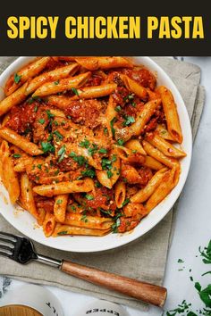 a white bowl filled with pasta covered in sauce