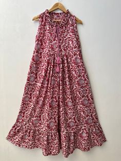 "pink maxi, cotton dresses, hand block print dress, boho maxi, long maxi, hippie dresses, vintage dress, floral maxi, bohemian maxi, ruffle dresses, maxi with pockets, Indian cotton maxi Feel beautiful and confident throughout your days wearing our block printed outfits, made with high quality soft and breathable cotton fabric.  The print on the dress is known as \"BLOCK PRINT\" which is centuries old technique of Indian textile carried out  by local artisans of Jaipur (INDIA). MEASUREMENTS (in inches): Size XXS-: Bust- 34″ | Shoulder- 13.5″ | Length- 51″ Size XS-: Bust- 36″ | Shoulder- 14″ | Length- 51″ Size S-: Bust- 38″ | Shoulder- 14.5″ | Length- 51″ Size M-: Bust- 40″ | Shoulder- 15″ | Length- 51″ Size L-: Bust- 42″ | Shoulder- 16″ | Length- 51″ Size XL-: Bust- 44″ | Shoulder- 16.5″ | Flowy Cotton Maxi Dress With Ruffles, Pink Sleeveless Boho Dress With Floral Print, Long Cotton Boho Dress With Boho Print, Flowy Cotton Boho Dress With Ruffles, Bohemian Cotton Midi Dress With Ruffles, Cotton Bohemian Dress With Ruffles, Cotton Bohemian Boho Dress With Ruffles, Bohemian Cotton Boho Dress With Ruffles, Bohemian Sleeveless Floral Dress