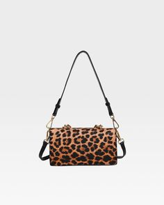 Unleash your wild side with this stunning Leopard Print Shoulder bag that perfectly blends fierce style with elegance. This bag features a bold leopard print design, crafted from high-quality materials that ensure durability and a luxurious feel. The standout gold-tone chain adds a touch of glamour, making this bag an ideal accessory for both day and night outings. Whether you're heading to a casual brunch or a chic evening event, this bag is your perfect companion, bringing a touch of exotic fl Trendy Leopard Print Bag With Detachable Strap, Leopard Print Rectangular Bag With Adjustable Strap, Trendy Leopard Print Crossbody Shoulder Bag, Leopard Print Shoulder Bag With Detachable Strap For Evening, Evening Shoulder Bag In Leopard Print With Detachable Strap, Leopard Print Leather Bag With Gold-tone Hardware, Evening Leopard Print Shoulder Bag With Detachable Strap, Leopard Print Rectangular Bag With Removable Pouch, Leopard Print Bags With Detachable Strap