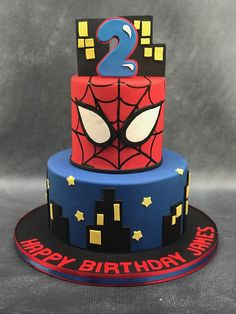 a spiderman birthday cake with the number two on top