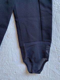 "Vintage black ski pants with stirrups to keep pants tucked into your boots. Wide banded waist with zipper fly and double snap closure. Excellent vintage condition! label: Edelweiss Skiwear fabric: 64% nylon, 34% wool, 2% lycra size: labeled size is 8, however, modern size is smaller. Please check measurements for an accurate fit. Questions are welcome! Pants were measured across the front side lying flat. There is slight stretch. waist 12 1/2\" hips 16 1/2\" total length to bottom of stirrup 38 Fitted Sporty Bottoms With Belt Loops, Sporty Fitted Bottoms With Belt Loops, Bombshell Dress, Hostess Apron, Boots Wide, Half Apron, Spaghetti Strap Top, Stirrups, Ski Pants