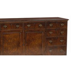 a large wooden dresser with many drawers and doors on it's sides, in an antique style