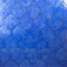 a blue tiled wall with circular designs on it