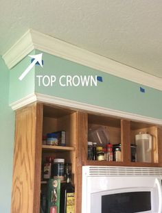 a kitchen cabinet with the words top crown above it and an arrow pointing to the left