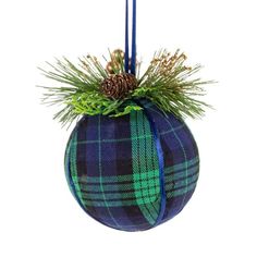 a blue and green plaid ornament hanging from a tree branch with pine cones