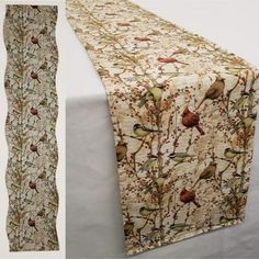 the table runner has birds on it and is next to an image of a tree