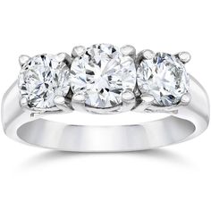 three stone diamond ring in white gold with diamonds on the sides and four stones at the top