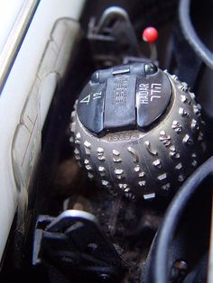 the inside of a car with several different types of buttons and knobs on it