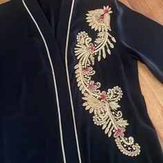 Women Abaya Worn Once Very Good Condition Beautiful Color And Material Size Large Elegant Embroidered Black Abaya, Elegant Embroidered Abaya For Festive Occasions, Traditional Black V-neck Abaya, Traditional Long Sleeve Abaya For Evening, Elegant Embroidered Kimono For Eid, Elegant Black Embroidered Kimono, Traditional Long Sleeve Evening Abaya, Formal Black Kaftan With Dabka Embroidery, Formal Black Kaftan With Dabka Detailing