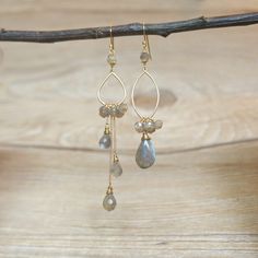 Labradorite cluster mismatched drop earrings, metal is gold plated over brass, high quality, 925 sterling silver gold plated ear hook. **With Labradorite faceted teardrop, size is approx 9mm x 6mm. **With Labradorite pear shape stone, size is approx 9mm x 16mm. **With Labradorite faceted beads, size is 4mm x 3mm. **Total length of these earrings is approx 71mm(short side) and 90mm(long side). **Important - the labradorite gemstone is natural stone, so natural cracked pattern maybe appeared. Each Minimalist Dangle Earrings, Crystal Point Jewelry, Asymmetric Earrings, Mismatch Earrings, Rose Gold Bridal Jewelry, January Birthstone Jewelry, Asymmetrical Earrings, Earrings Gemstone, Bar Stud Earrings