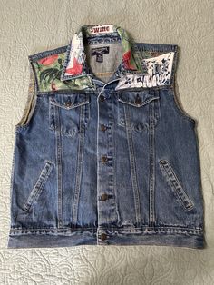 Made from a rescued jacket & scraps of vintage Alexander Henry fabric. Size is Men’s XL. Would look great on anyone. Casual Upcycled Sleeveless Denim Vest, Casual Upcycled Sleeveless Vest, Casual Upcycled Vest, Vintage Cotton Denim Vest For Festivals, Levis Black Jeans, Reworked Nike, Flower Hoodie, Black Jean Jacket, Boho Beachy