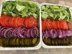 two plastic trays filled with different types of vegetables