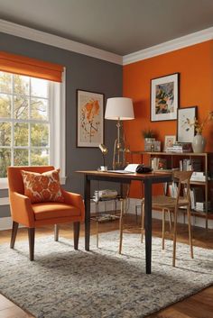 an orange and gray living room with two chairs, a table and a lamp in it