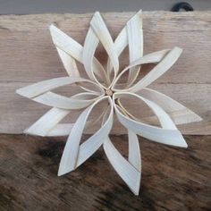 a wooden snowflake sitting on top of a table