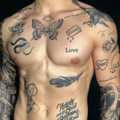 a man with tattoos on his chest has an orange piece in the middle of his stomach