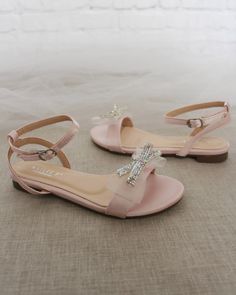 "Classy satin flat sandals with mesh mini rhinestones bow and ankle strap. Effortless yet adorable to wear on your favorite occassion. Can be pair with dress or casual look. DETAILS: COLORS AVAILABLE: Ivory, White, Pink, Light Blue, and Champagne UPPER: Synthetic upper and lining MATERIALS: Mandmade outsole STYLE NAME: MADDY Not sure of which size to purchase? Shoes measurements are as follow: (Please note measurements taken the length of inside of shoe from toe to heel) KIDS SIZE: Size 9 - 7\" Kids Heels, Women's Slip Ons, Girls Flats, Girls Heels, Bridesmaid Shoes, Rhinestone Bow, Kids Sandals, Pink Light, Navy Pink