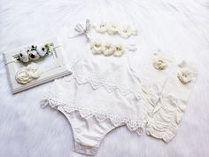 "OFF WHITE BOHO ROMPER Elegant super soft romper embellished with beautiful quality chiffon flowers with jewels and pearls. {use} *Birthday, *Baptism, *Easter, *special occasions, *picture props, *weddings, *for fun! Available dress sizes below: 0-6 months 6-12 months 12-24 months 2T CHOICE OF HEADBANDS-- #1 #2 #3 #4 Beautiful matching headbands adorned with jeweled flower and can be also made on hard headband or alligator clip. If you need hard headband or on alligator clip, please leave a note Cream Bubble Romper With Ruffles For Baptism, Cream Ruffled Bubble Romper For Baptism, White Bubble Romper For Baptism In Summer, White Bubble Romper For Baptism, Spring Baptism Cream Bubble Romper, White Bubble Romper For Baptism In Spring, White Bubble Romper For Baptism And Spring, White Fitted Bubble Romper For First Birthday, Fitted White Bubble Romper For First Birthday