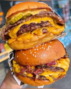 two cheeseburgers stacked on top of each other