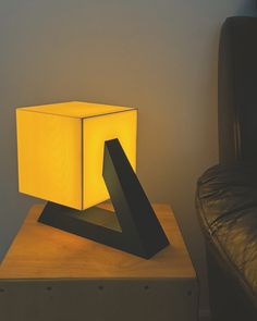 a lamp sitting on top of a wooden table