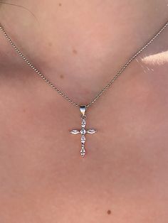 "✦ DESCRIPTION ✦ Five brilliant prong set marquise cut simulated diamonds make up this beautiful cross pendant crafted in Rhodium plated 925 Sterling silver. It's Perfect for everyday wear. It hangs from a silver Ball style chain. - White Rhodium plated Sterling silver. Measurement of the Cross Pendant: Length :25 mm Width : 12 mm Ball Chain Measurement: 15.5\" / 17.5\" / 19.5\" inch -925 STAMPED ✦Dear Customers ✦ We strive to provide the best quality with affordable prices. We take such pride i Diamond Cross Jewelry With Rhinestones, Cross-shaped Diamond Jewelry With Rhinestones, Cross-shaped Jewelry With Cubic Zirconia In Prong Setting, Cross Shaped Cubic Zirconia Jewelry With Prong Setting, Elegant Cubic Zirconia Cross Pendant Necklace, Elegant Cubic Zirconia Cross Necklace, Elegant Crystal Cross Necklace, Elegant Silver Cross Necklace With Cubic Zirconia, Elegant Cross Necklace With Diamond Accents And Cubic Zirconia