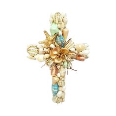 a cross made out of seashells and pearls