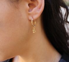 "these small dainty hoops have the same initial charm as the necklace and ring. Stack them with your other hoops or let them shine on their own. L E T S . T A L K . E A R R I N G S ✤ Available in 14k gold filled and Sterling Silver ✤ Tarnish resistant ✤ Safe for sensitive skin ✤ Available in one size - Hoop is approx 16mm / Hoop with initial is approx 1\" ✤ Comes as a single and you can order more ✤ Please use the personalization box to let us know the initial that you would like. All Tommassini Personalized Everyday Hoop Jewelry, Stacking Earrings, Earrings Silver Hoops, Earrings Stacking, Gold Hoop Earring, Initial Earrings, Stacked Earrings, Big Hoop Earrings, Ring Stack