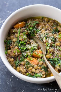 a white bowl filled with lentils, carrots and parmesan cheese