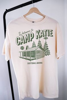 Elevate your bachelorette celebration with our custom Camp Bachelorette themed t-shirt! Perfect for the ultimate camping bachelorette getaway, this oversized Comfort Colors tee promises both style and comfort. Crafted from high-quality, soft-washed cotton, it offers a relaxed fit that's ideal for any outdoor adventure. Personalize your bachelorette merch with unique designs and text to make your special occasion even more memorable. Whether you're lounging by the campfire or hitting the trails, Camp Bachelorette Outfit, Camp Themed 30th Birthday, Camp Bachelorette Sweatshirt, Camping T-shirts, Camp 30th Birthday, Camp Bachelorette Shirts, Summer Camp Bachelorette Party, Hiking Bachelorette Party, Camp Merch