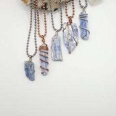 Raw Blue Kyanite necklace wrapped with real sterling silver wire or pure copper wire. It includes a ball chain or black or brown faux suede cord (cord adjusts from 12"-24") If you prefer a sterling silver chain, you can find them here - https://www.etsy.com/listing/757293463/sterling-silver-rolo-chain?ga_search_query=chain&ref=shop_items_search_1 ◇ Meaning  Blue Kyanite has a high vibration and rapid transfers of energy. It is an extraordinary crystal of connection, and immediately aligns the chakras and subtle bodies, bringing tranquility and a calming effect to the whole being. Kyanite neither accumulates nor retains negative energy, and therefore never needs cleansing, and it may be used for cleansing and clearing other crystals. ◇ Please do not hesitate to contact me for custom orders Adjustable Blue Wire Wrapped Crystal Necklace, Blue Wire Wrapped Crystal Necklace For Healing, Blue Kyanite Crystal, Subtle Bodies, Kyanite Necklace, Kyanite Crystal, Suede Cord, Blue Kyanite, Rolo Chain