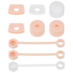 an assortment of plastic parts on a white background