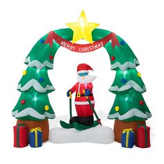 an inflatable christmas scene with santa and trees