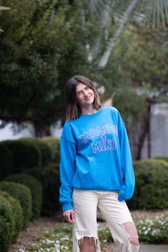 Introducing our Malibu and Mint Sweatshirt, a perfect blend of comfort and coastal vibes for those who embrace the sun, sand, and sea. Crafted with soft, breathable fabric, this sweatshirt is your go-to companion for breezy beach days or cozy evenings by the bonfire. The design captures the essence of pure joy with playful and vibrant hues that reflect the cheerful spirit of beach life. Embrace the sunshine in style and spread positive vibes with this Malibu and Mint Sweatshirt – where comfort meets the carefree allure of the ocean. *For an oversized fit, size up 1-2 sizes* **Washing Instructions: For best results, wash garment inside out in cold water. Avoid hot water to preserve fabric quality. Hang to dry to maintain shape and color vibrancy. Do not tumble dry or bleach. Blue French Terry Sweats For Loungewear, Blue Cotton Leisure Sweats, Vacation Cotton Long Sleeve Sweater, Sporty Summer Sweatshirt For Leisure, Sporty Summer Leisure Sweatshirt, Cotton Long Sleeve Sweater For Vacation, Casual Blue Sweats With Letter Print, Summer Casual Sweatshirt For Loungewear, Casual Summer Loungewear Sweatshirt