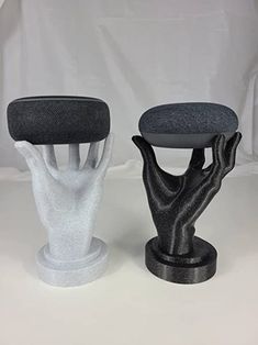 two black and white stools sitting next to each other