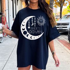 a woman wearing a t - shirt that says bride's over the moon on it