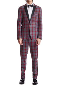 Make an entrance in this classic red and charcoal tartan tux jacket. Accented with a beautiful statement lining and matching pocket square. PRODUCT DETAILS: style 6001J slim fitting 1 button jacket peak lapel complimentary pocket square side vents 100% Polyester dry clean only imported