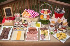 a table filled with lots of food and condiments