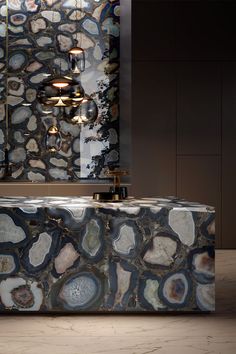 a bath tub sitting in front of a mirror next to a wall with lights on it