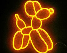 a neon sign with a teddy bear on it