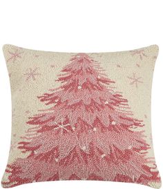 a red christmas tree pillow on a white background