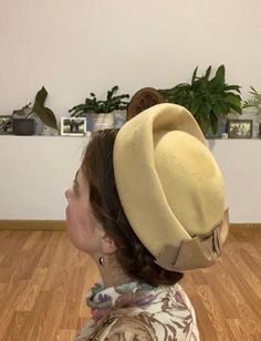 "This is truly a perfectly delightful 1960s Hat! The Felt structure and elegant bow make this a perfect all season piece! Now, with winter just around the bend, its the right time to find the hat that suits your style best! This piece has the classic 'high crown' look of the decade and sits comfortably on your head! I truly love it myself but, since I'm into earlier decades, I thought it might find a forever home with someone special! Overall this hat is in wonderful condition! A small darkened Vintage Adjustable Beige Boater Hat, Vintage Adjustable Costume Hats With Structured Crown, Vintage Beige Fedora Felt Hat, Vintage Beige Felt Hat For Winter, Vintage Beige Boater Hat With Curved Brim, Vintage Beige Fascinator With Curved Brim, Retro Wide Brim Cloche Hat For Winter, Retro Beige Short Brim Hat, Vintage Cream Hat For Evening