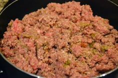 the ground beef is cooked and ready to be cooked in the pot on the stove