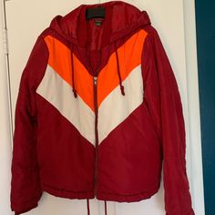 Retro Style 70s 80s Puffer Jacket. Hooded With Drawstrings. Drawstrings Along The Hem. Red, Orange And White. Chevron Pattern On Front. Zipper Closure. Two Side Pockets. Nice Seasonal Transition Jacket! Recycled Polyester. Never Worn. Retro Red Hooded Outerwear, Retro Red Windbreaker For Fall, Trendy Red Windbreaker For Fall, Trendy Red Fall Windbreaker, Retro Fall Outerwear With Double-lined Hood, Retro Hooded Fall Windbreaker, Red Spring Outerwear With Adjustable Hood, Retro Hooded Windbreaker For Fall, Retro Hooded Jacket With Pockets For Fall