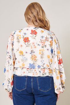 Sunkissed by primary colored floral motifs. A dream garden floral print shapes this elegant blouse with voluminous balloon sleeves and V neckline. It maintains a blouson bodice shaped by an elastic waist to create a semi peplum silhouette. Pair the look with medium washed denim and brown sandals for a casual day out.- Elastic waist- Peplum- Cropped- Lined- Color: Floral PrintSize + Fit - Model is 5'9" and wearing size 2X- Measurements taken from size 2X - Chest: 52"- Length: 24 1/2" Fabric Self: Floral Print Puff Sleeve Peasant Top For Brunch, Summer Balloon Sleeve Floral Tops, Brunch Blouse With Blouson Bishop Sleeves, Blouson Bishop Sleeve Blouse For Brunch, Bishop Sleeve Blouse With Blouson Sleeves For Brunch, Blouse With Blouson Bishop Sleeves For Brunch, Spring Tops With Floral Print And Puff Sleeves, Multicolor Balloon Sleeve Blouse For Spring, Spring Brunch Blouse With Gathered Sleeves