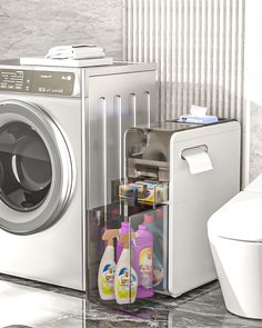 a washer and dryer sitting next to each other near a toilet in a bathroom