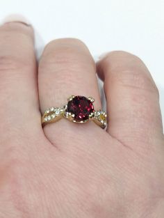 Gorgeous gold finish Garnet Strass Brilliant cut crystal Ring with clear dazzling crystals.  It shines like real gold. GREAT Gift! No Tarnish Size 7 1/2 It will come in a gift bag. Gold Crystal Rings As Gifts, Gold Crystal Ring For Gift, Gold Crystal Rings For Gift, Gold Crystal Ring With Sparkling Stones, Dazzling Gold Crystal Rings, Gold Diamond Ring With Rhinestones, Gold Crystal Promise Ring With Rhinestones, Gold Rings With Rhinestones, Gold Crystal Ring With Diamond Accent Stones