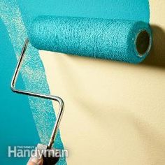 a roll of blue fabric sitting on top of a white table next to a wall