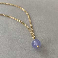 "PURPLE AMETHYST CHAIN NECKLACE This necklace features a dainty, natural gemstone threaded on a 14k Gold Filled, Stainless Steel chain. Available in color options, this necklace is ideal for layering & makes the perfect gift! Please visit our store for other color options! Those who keep Amethyst close will find that they feel comforted, grounded and soothed in a truly uplifting way. ☆ Each of the stones we use to create necklaces were formed by nature over years. Each one is unique and beautiful just like nature itself.  We do not process or change our stones in any way, we accept their \"unique and raw\" beauties. We don't polish away \"flaws\" in the stones but rather leave them in their natural state.  Just like people, each stone has special characteristics unique to itself and in tha Blue Amethyst Pendant Necklaces, Blue Amethyst Pendant Necklace, Gift Crystal Necklaces With Delicate Chain And Round Beads, Blue Amethyst Crystal Necklace For Gift, Lavender Gemstone Beaded Necklaces As Gift, Amethyst Necklace With Delicate Chain For Gift, Lavender Gemstone Beaded Necklaces For Gift, Lavender Gemstone Beads Necklace For Gift, Delicate Amethyst Chain Necklace As A Gift