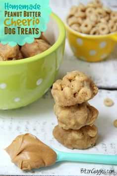 peanut butter cheerio dog treats stacked on top of each other in front of a bowl