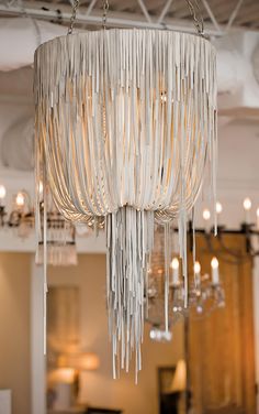 a chandelier hanging from the ceiling in a room